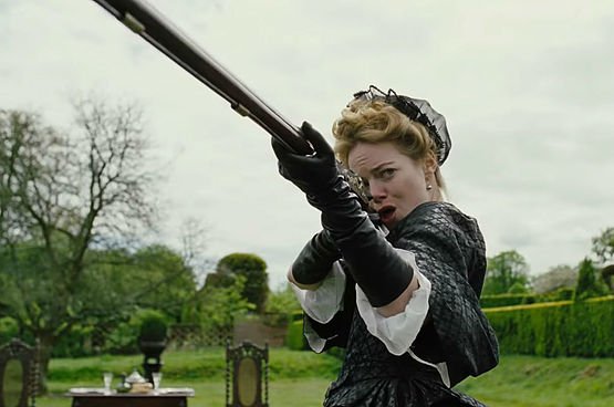 Emma Stone points a rifle at the sky as Abigail Masham in The Favourite