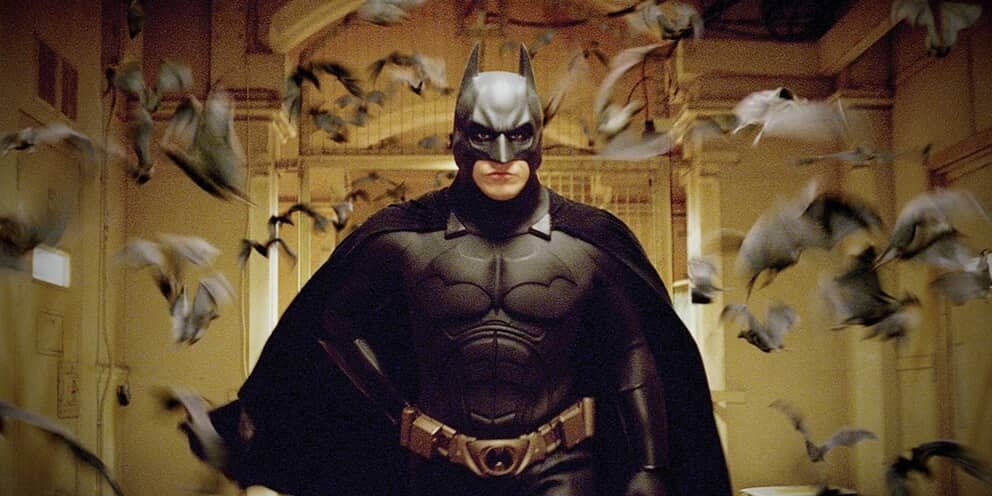 Christian Bale in Batman Begins surrounded by bats