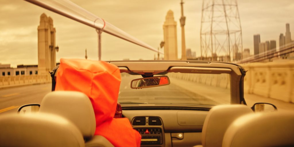 a character in a car in the film LX 2048