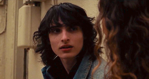 Finn Wolfhard looks at his mother in a still from the film When You Finish Saving the World from director Jessie Eisenberg, whose new movie, A Real Pain, cements his creative focus according to Loud and Clear Reviews