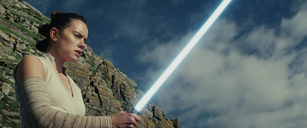 loud and clear reviews why The Last Jedi is a Great Sequel to The Force Awakens star wars film movie rey with lightsaber