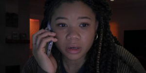 a girl is on the phone and looks worried in the film Missing