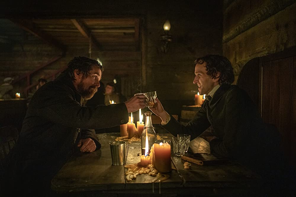 Christian Bale as Augustus Landor and Harry Melling as Edgar Allen Poe in The Pale Blue Eye