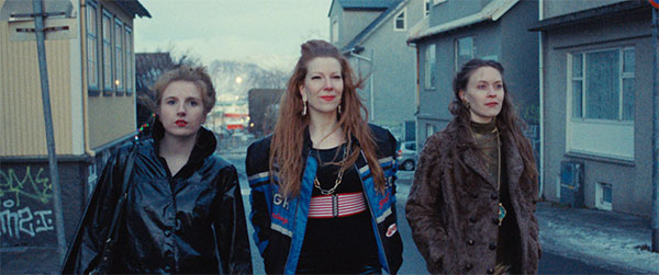 Three girls walk down the street in a still from Álfrún Örnólfsdóttir’s film Band