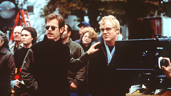 William H. Macy has his hand on Phillip Seymour Hoffman's shoulder in the film State and Main