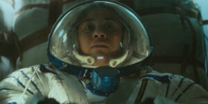 A woman wears an astronaut suit in a still from Gabriela Cowperthwaite's film I.S.S.