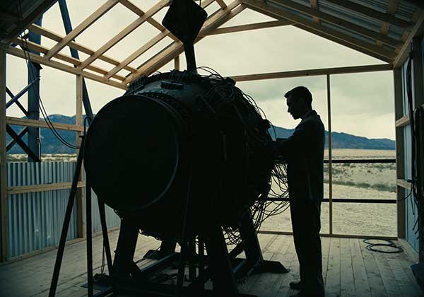 Cillian Murphy stands close to the atomic bomb in the film Oppenheimer, whose line "I Am Become Death" is explained in Loud and Clear Reviews' article