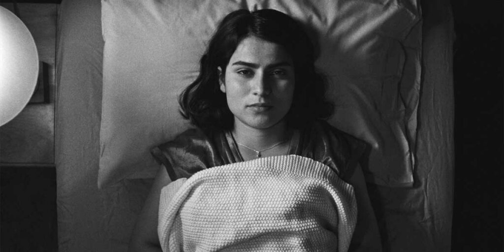 Anaita Wali Zada in bed in the film Fremont
