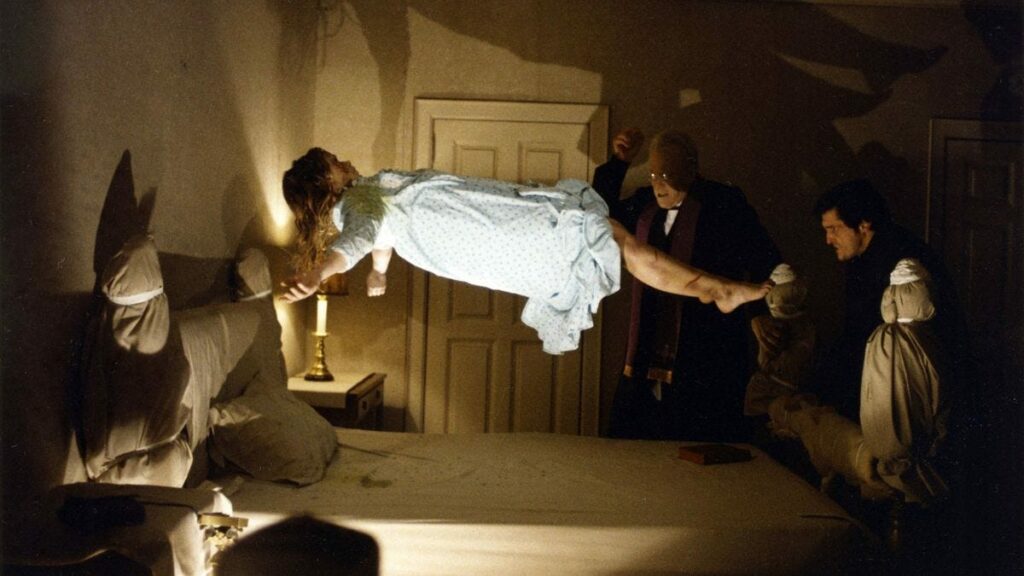 The bed scene from The Exorcist, one of the 10+ movies to watch at Halloween 2024 according to Loud and Clear Reviews