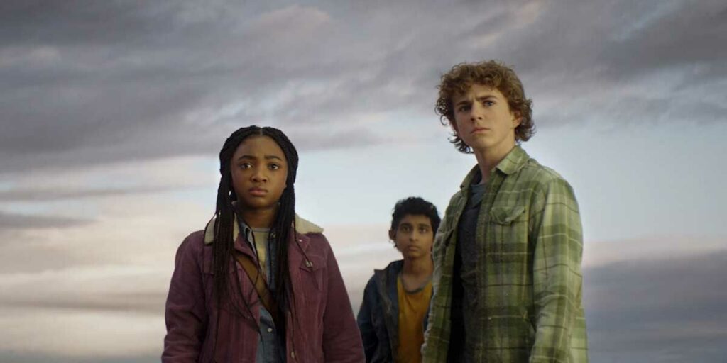 The three main characters of the Percy Jackson Series stand looking solemn