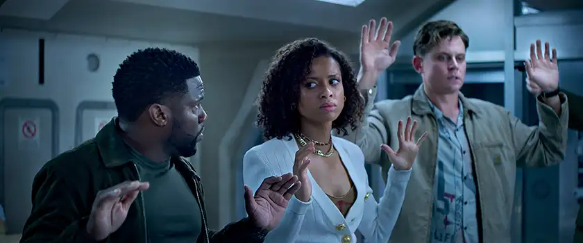 Kevin Hart as Cyrus, Gugu Mbatha-Raw as Abby and Billy Magnussen as Magnus in a still from Lift