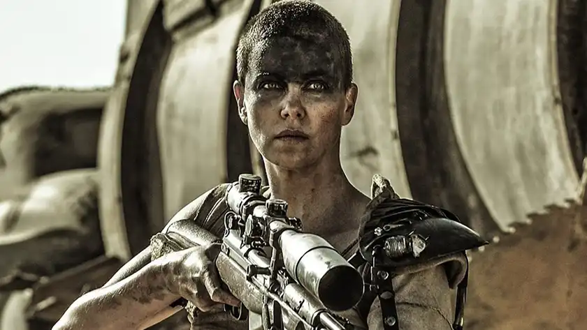 Charlize Theron with a gun in Mad Max: Fury Road