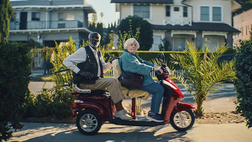 Richard Roundtree and June Squibb on a motorbike in the film Thelma by Josh Margolin