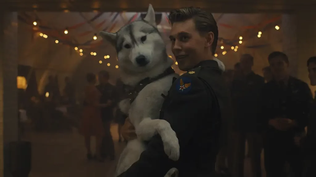 Austin Butler holds a puppy in episode 4 of Masters of the Air