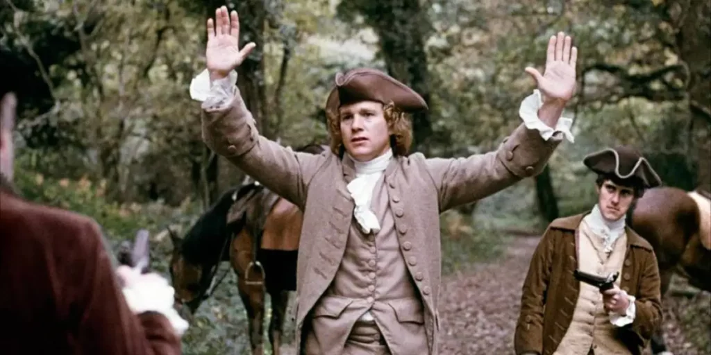 Barry Lyndon raises his hands in a still from the film