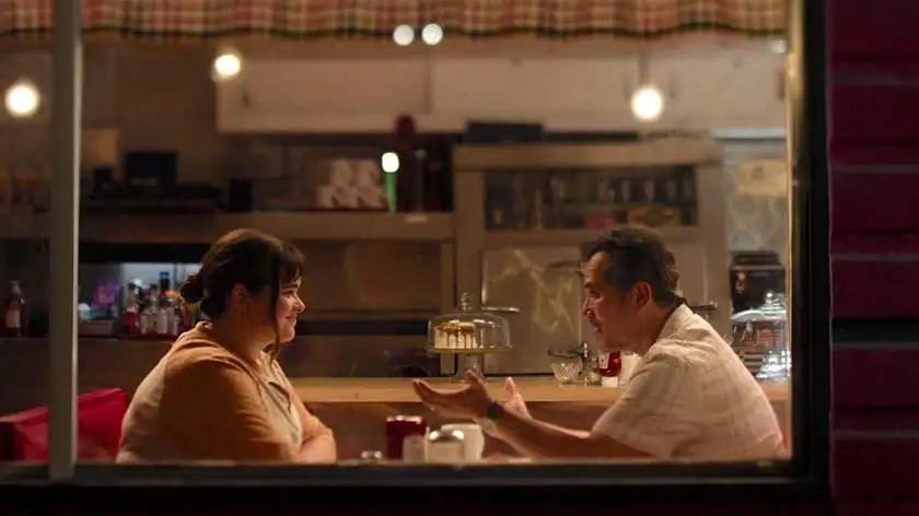 two characters face each other in a restaurant in the film BOB TREVINO LIKES IT, one of the 10 films to watch at sxsw 2024