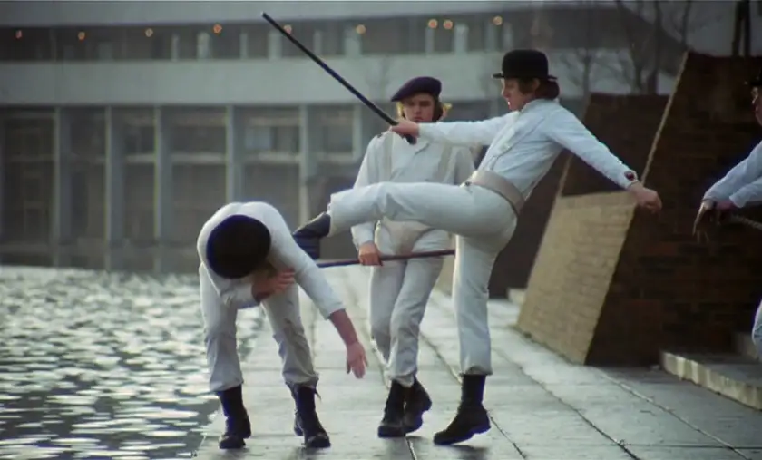 characters kicking each other dressed in white in Kubrick's film A Clockwork Orange