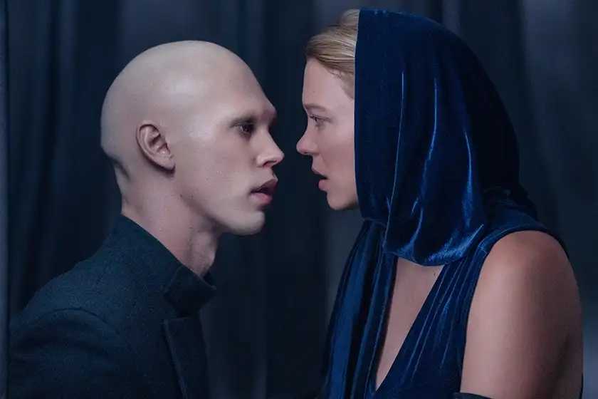 AUSTIN BUTLER as Feyd-Rautha Harkonnen and LÉA SEYDOUX as Lady Margot Fenring stare at each other in the film Dune 2