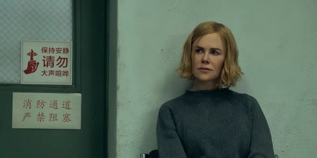 Nicole Kidman leans against a wall in Episode 4 of Prime Video series Expats