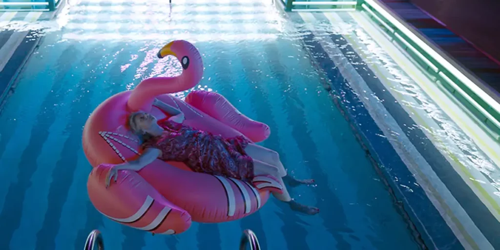 Esther Gemsch floats on a flamingo-shaped air mattress in the film Golden Years