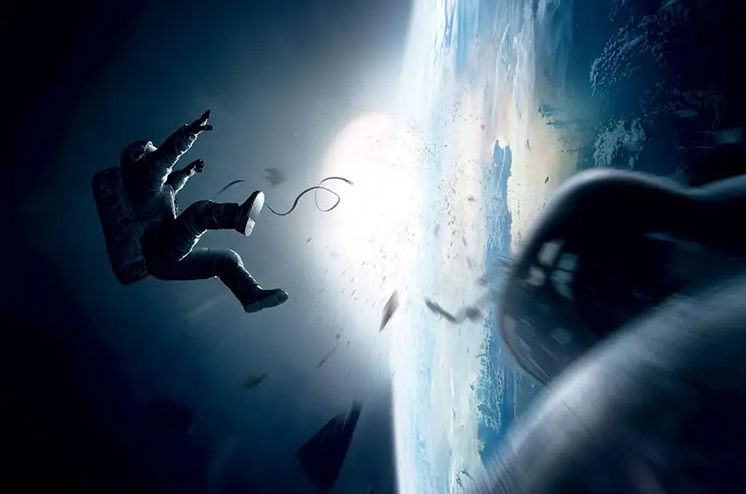An astronaut is floating in space in a stunning photo from the film Gravity