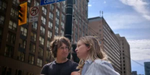 Mounir Al Shami and Deragh Campbell stand on a crossroad in New York in Matt and Mara