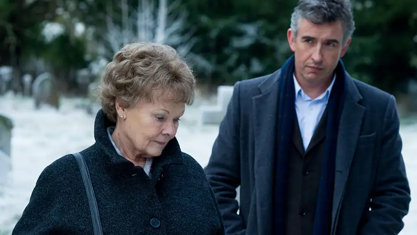 Judy Dench and Steve Coogan stand outdoors in 2014 best picture nominee Philomena