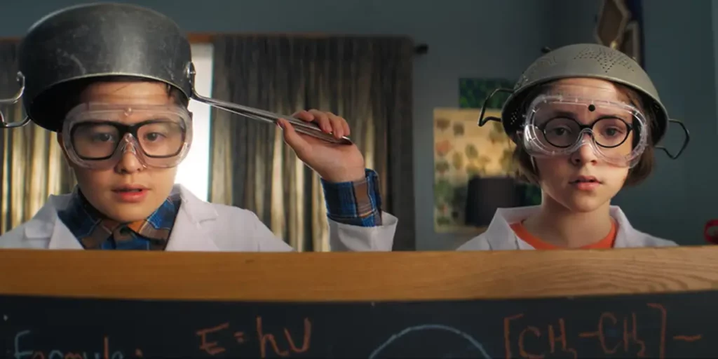 two characters with pots on their heads in the film Popular Theory