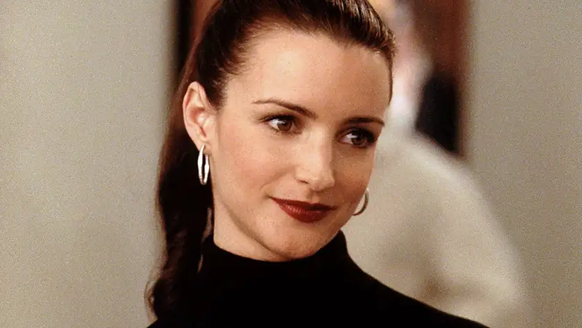 Kristin Davis wears a ponytail and a black jumper as Charlotte in Sex and the City
