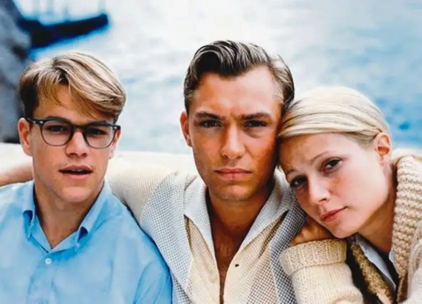 Matt Damon, Jude Law, and Gwyneth Paltrow look at the camera in the film The Talented Mr Ripley