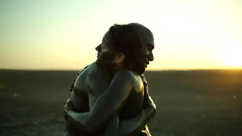 two people hug in the film The Black Se