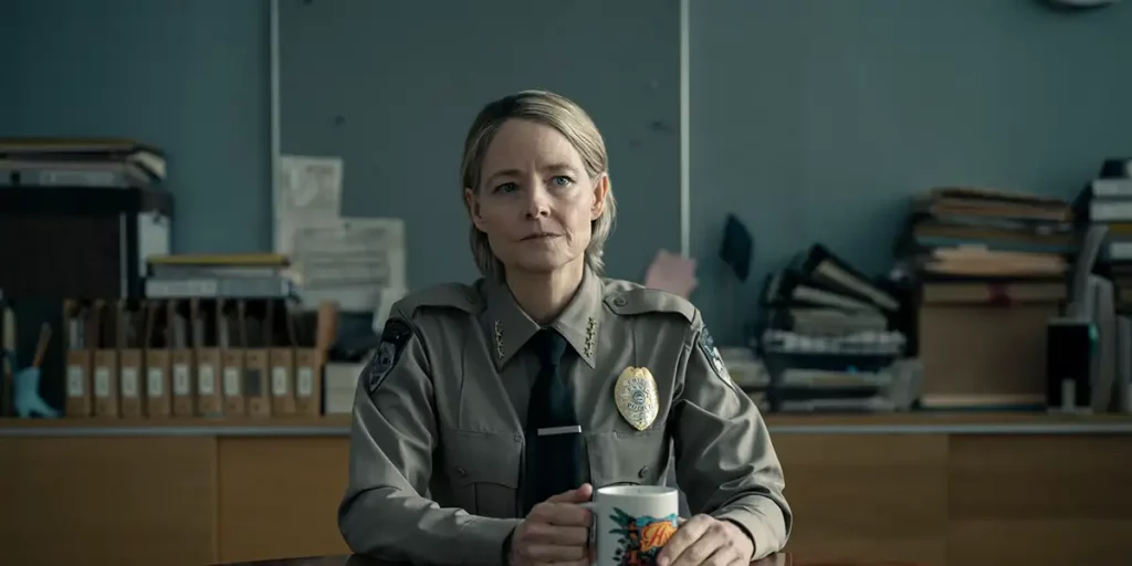 Jodie Foster sits behind her desk in her uniform in Episode 6 of True Detective: Night Country
