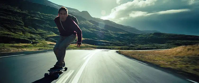 Ben Stiller is on a skateboard in the film The Secret Life of Walter Mitty, one of the movies to watch if you feel lost