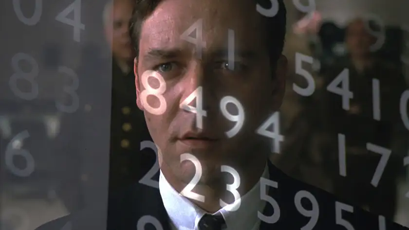 Russell Crowe face with numbers in front of it in the film A Beautiful Mind, one of the 5 Films About Math to watch on Pi Day according to Loud And Clear Reviews