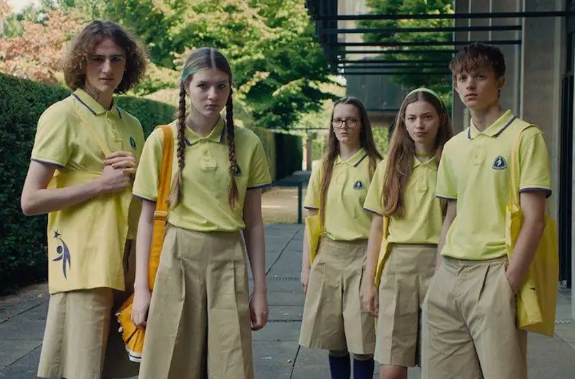 Students wearing yellow uniforms look very thin and emotionless in the film Club Zero