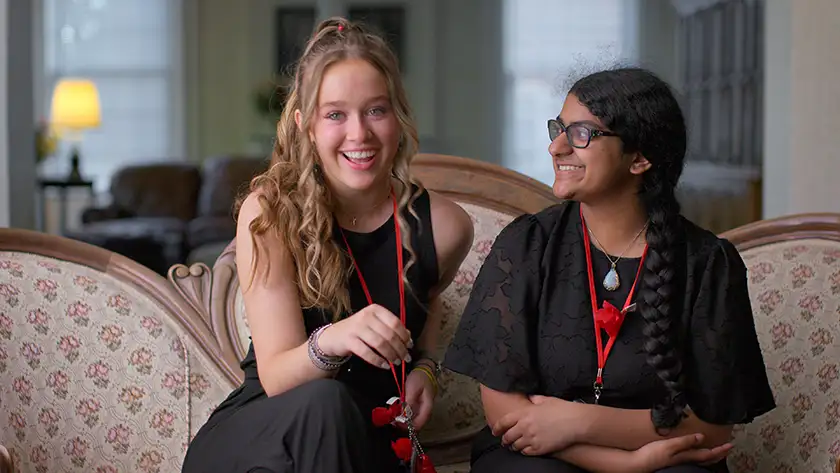 Brooke Taylor and Nisha Murali sit on the couch in Apple TV+ documentary film "Girls State," 