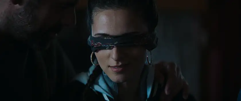 A woman has a bandage over her eyes in the film Hunting Daze
