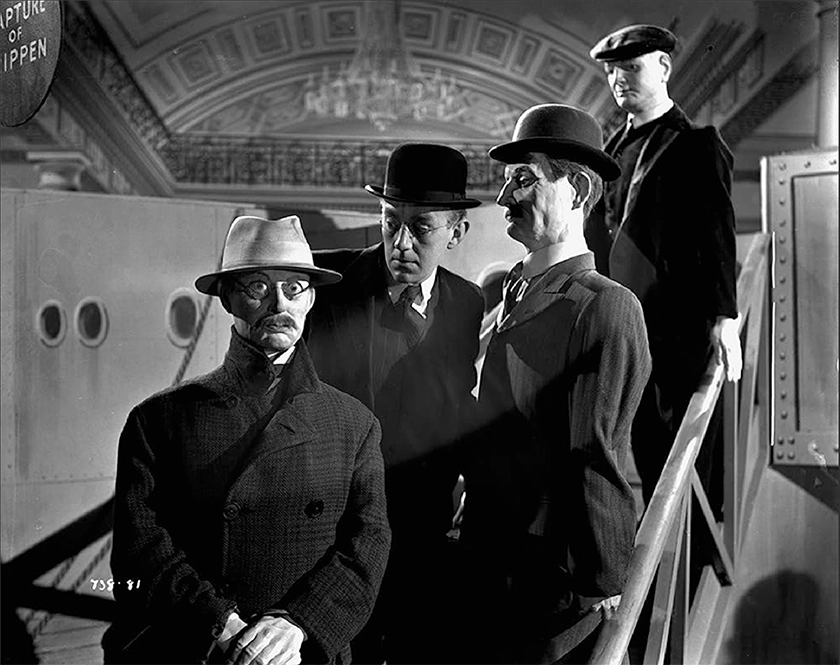 Four characters on a staircase in the film The Lavender Hill Mob