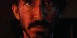 A close up of Dev Patel's face in the film Monkey Man