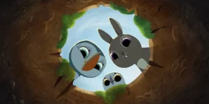 a puffin, a bunny and an owl look down a hole in a still from the film Puffin Rock and the New Friends