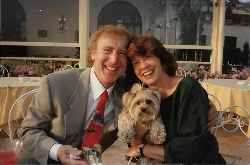 Gene Wilder and wife Karen Boyer pose with their dog at the dinner table, in a photograph shown in the documentary Remembering Gene Wilder