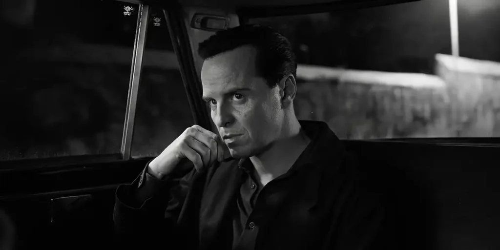 Andrew Scott sits inside a taxi looking deep in thought in the Netflix series Ripley