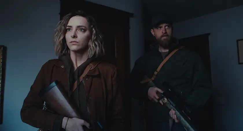 two characters hold rifles in the dark in the film Things Will Be Different