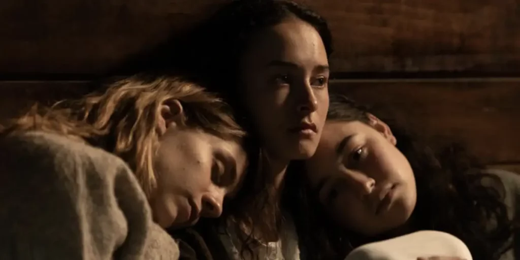 Three girls hug each other in the film We Were Dangerous