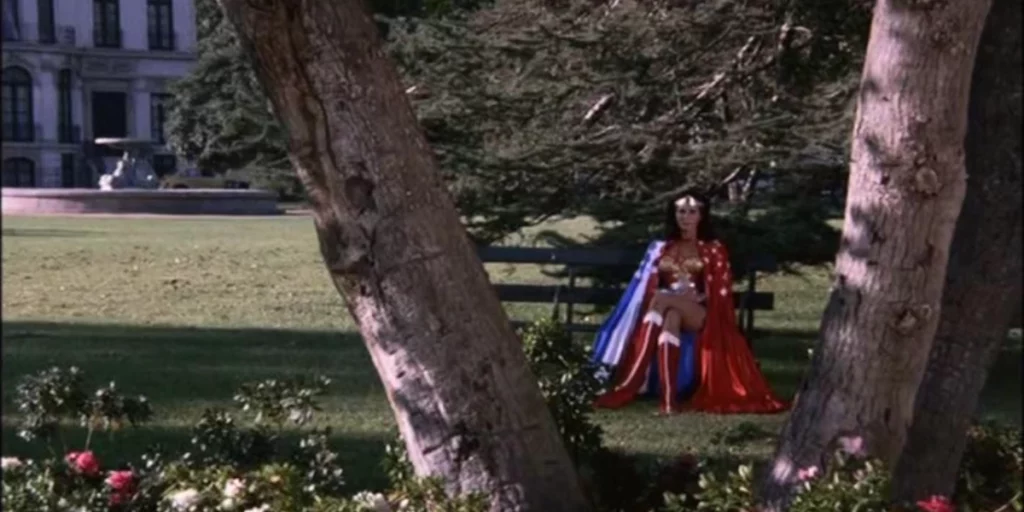 Wonder Woman sits between trees in episode 10 of Wonder Woman