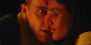 two characters have their faces close to each other in the film Birdeater