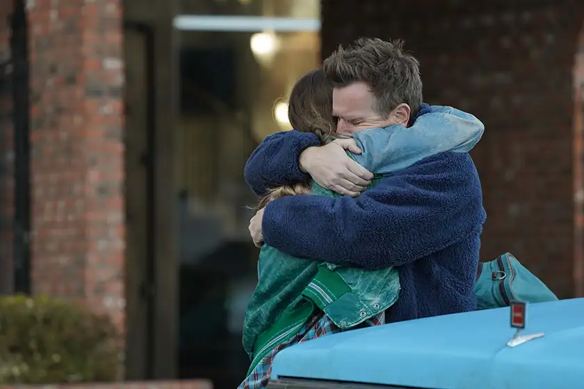 Ewan and Clara McGregor hug in the film Bleeding Love, from director Emma Westenberg, featured on Loud and Clear Reviews' interview