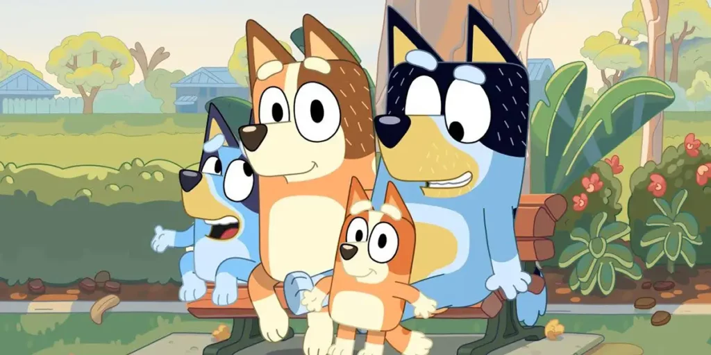 The four main characters of the series Bluey sit on a bench