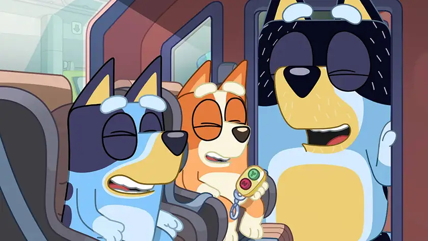 Three characters of Bluey laugh inside a bus in the episode "Dance Mode", one of the 5 Best Episodes of Bingo according to Loud and Clear Reviews