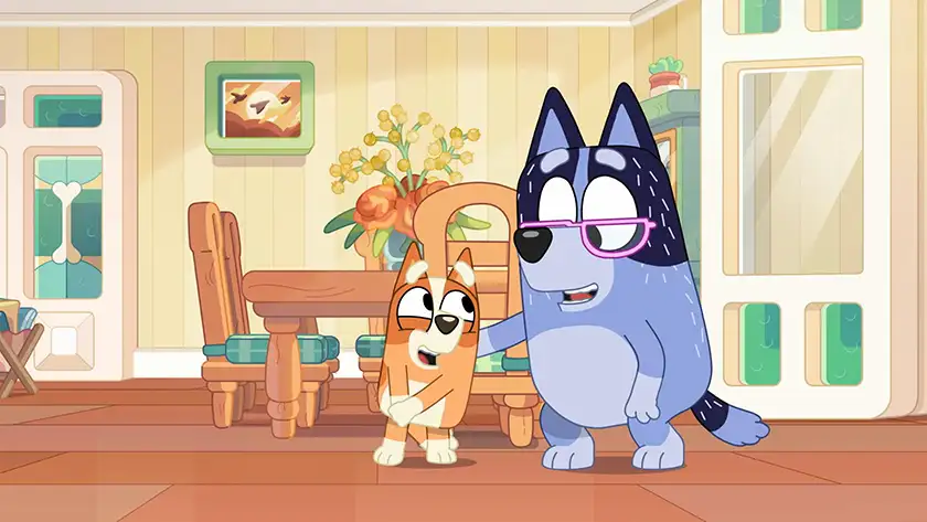 Bingo and Bluey hug in "Handstand", one of the 5 Best Episodes of Bingo according to Loud and Clear Reviews